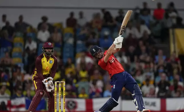 England's Will Jacks hits for six runs from the bowling of West Indies' Akeal Hosein during the second T20 cricket match at Kensington Oval in Bridgetown, Barbados, Sunday, Nov. 10, 2024. (AP Photo/Ricardo Mazalan)