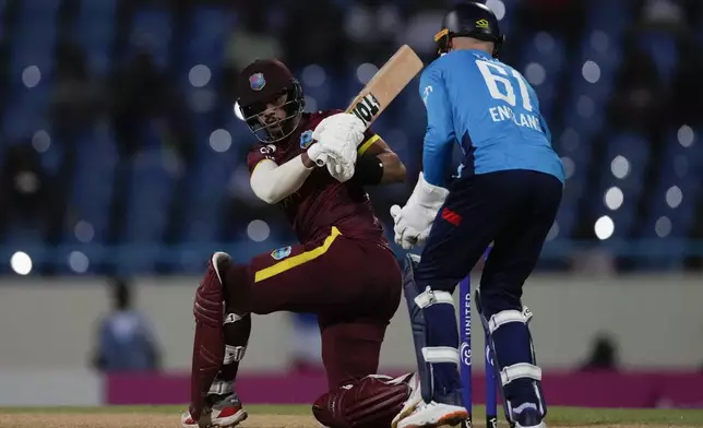 West Indies' Brandon King plays a shot from a delivery of England's captain Liam Livingstone during the first ODI cricket match at Sir Vivian Richards Ground in North Sound, Antigua and Barbuda, Thursday, Oct. 31, 2024. (AP Photo/Ricardo Mazalan)