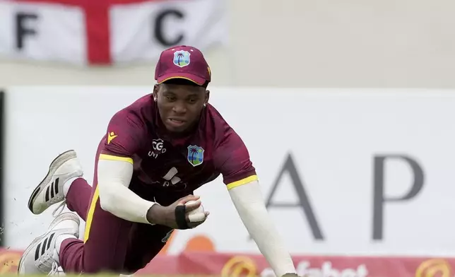 West Indies' Keacy Carty takes the catch to dismiss England's Jordan Cox during the first ODI cricket match at Sir Vivian Richards Ground in North Sound, Antigua and Barbuda, Thursday, Oct. 31, 2024. (AP Photo/Ricardo Mazalan)