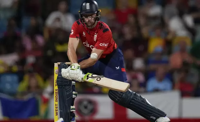 England's captain Jos Buttler plays a shot against West Indies during the second T20 cricket match at Kensington Oval in Bridgetown, Barbados, Sunday, Nov. 10, 2024. (AP Photo/Ricardo Mazalan)