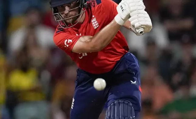 England's Phil Salt plays a shot against West Indies during the second T20 cricket match at Kensington Oval in Bridgetown, Barbados, Sunday, Nov. 10, 2024. (AP Photo/Ricardo Mazalan)