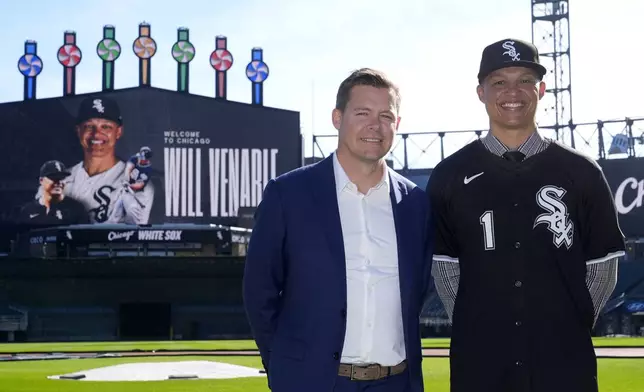 Chicago White Sox's new manager Will Venable, right, stands for a portrait with General Manager Chris Getz after the baseball team's news conference Friday, Nov. 8, 2024, in Chicago. (AP Photo/Charles Rex Arbogast)