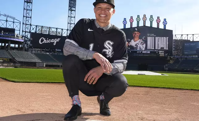 Chicago White Sox's new manager Will Venable poses for a portrait after the baseball team's news conference Friday, Nov. 8, 2024, in Chicago. (AP Photo/Charles Rex Arbogast)