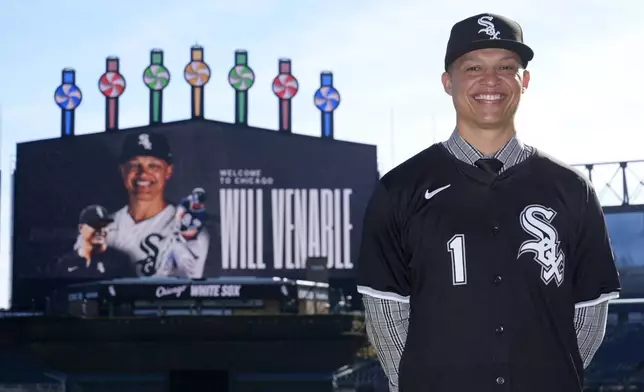 Chicago White Sox's new Manager Will Venable poses for a portrait after the baseball team's news conference Friday, Nov. 8, 2024, in Chicago. (AP Photo/Charles Rex Arbogast)