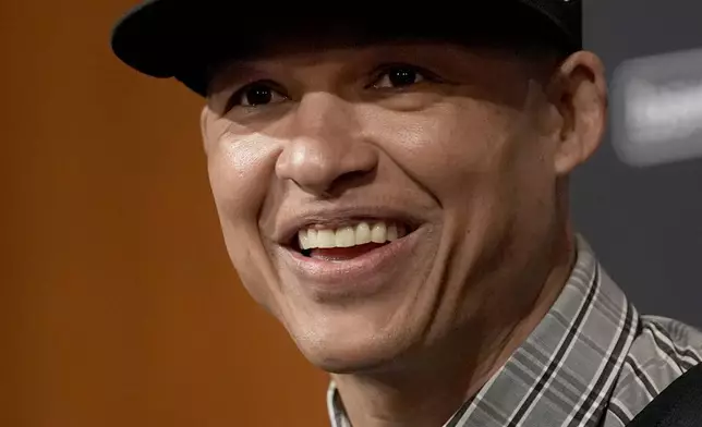 Chicago White Sox's new manager Will Venable smiles during the baseball team's news conference Friday, Nov. 8, 2024, in Chicago. (AP Photo/Charles Rex Arbogast)