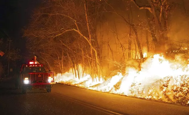 This image provided by New Jersey Department of Environmental Protection shows the wildfire in Jennings Creek, N.J., Saturday, Nov. 9, 2024. (New Jersey Department of Environmental Protection via AP)