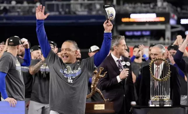 Los Angeles Dodgers manager Dave Roberts celebrates their win against the New York Yankees in Game 5 to win the baseball World Series, Thursday, Oct. 31, 2024, in New York. (AP Photo/Ashley Landis)