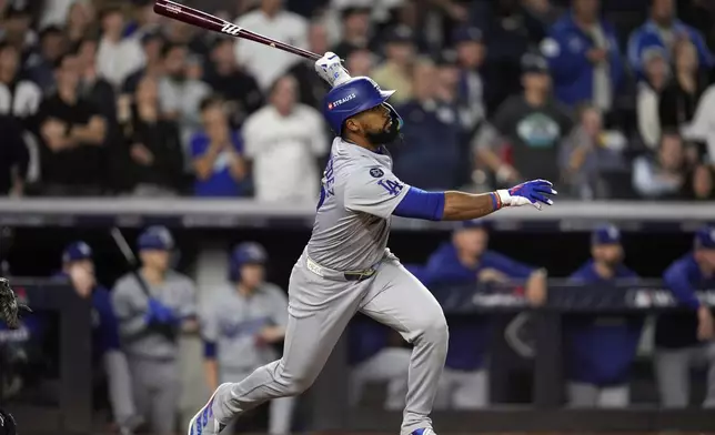 Los Angeles Dodgers' Teoscar Hernández hits a two-run double against the New York Yankees during the fifth inning in Game 5 of the baseball World Series, Wednesday, Oct. 30, 2024, in New York. (AP Photo/Godofredo A. Vásquez)