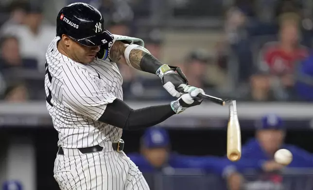 New York Yankees' Gleyber Torres breaks his bat as he grounds out against the Los Angeles Dodgers during the seventh inning in Game 5 of the baseball World Series, Wednesday, Oct. 30, 2024, in New York. (AP Photo/Godofredo A. Vásquez)