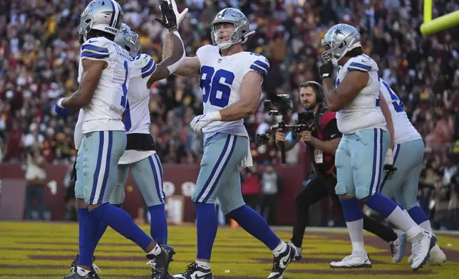 Dallas Cowboys tight end Luke Schoonmaker (86) celebrates after scoring a 22-yard touchdown during the second half of an NFL football game against the Washington Commanders, Sunday, Nov. 24, 2024, in Landover, Md. (AP Photo/Stephanie Scarbrough)