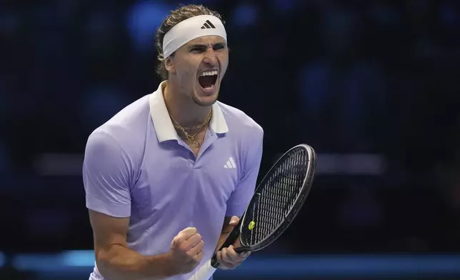 Germany's Alexander Zverev celebrates after winning the set point during the singles tennis match of the ATP World Tour Finals against Spain's Carlos Alcaraz, at the Inalpi Arena, in Turin, Italy, Friday, Nov. 15, 2024. (AP Photo/Antonio Calanni)