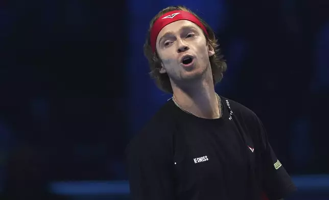 Russia's Andrey Rublev reacts during the singles tennis match of the ATP World Tour Finals against Norway's Casper Ruud, at the Inalpi Arena, in Turin, Italy, Friday, Nov. 15, 2024. (AP Photo/Antonio Calanni)