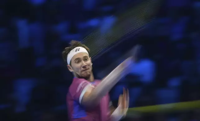 Norway's Casper Ruud returns the ball to Russia's Andrey Rublev during their singles tennis match of the ATP World Tour Finals at the Inalpi Arena, in Turin, Italy, Friday, Nov. 15, 2024. (AP Photo/Antonio Calanni)