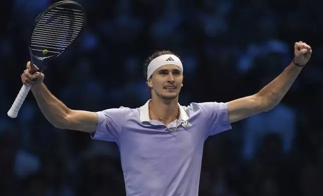 Germany's Alexander Zverev celebrates after winning the set point during the singles tennis match of the ATP World Tour Finals against Spain's Carlos Alcaraz, at the Inalpi Arena, in Turin, Italy, Friday, Nov. 15, 2024. (AP Photo/Antonio Calanni)