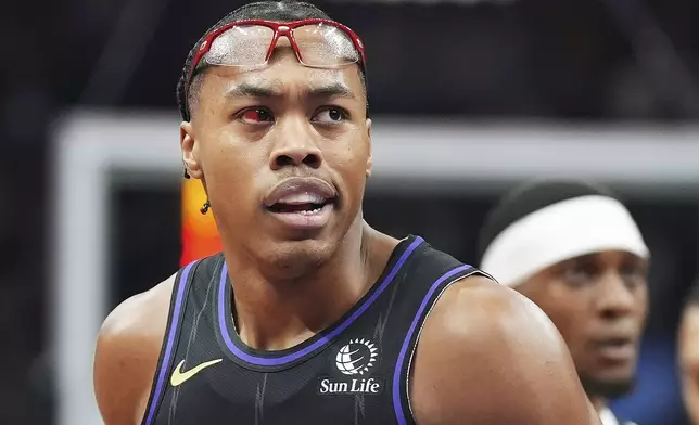 Toronto Raptors' Scottie Barnes (4) protests to a referee after receiving a technical foul during first-half NBA basketball game action against the Minnesota Timberwolves in Toronto, Thursday, Nov. 21, 2024. (Frank Gunn/The Canadian Press via AP)