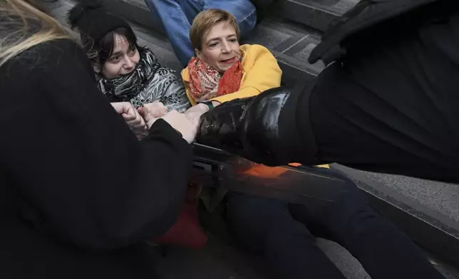 Skirmishes between Serbian police and opposition protesters demanding arrests over a deadly roof collapse at a railway station in Novi Sad, Serbia, Wednesday, Nov. 20, 2024. (AP Photo)