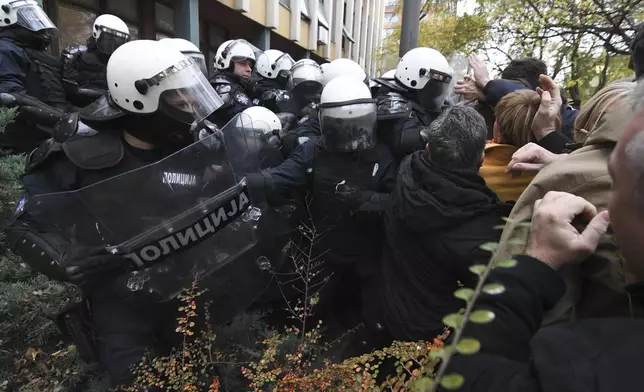 Skirmishes between Serbian police and opposition protesters demanding arrests over a deadly roof collapse at a railway station in Novi Sad, Serbia, Wednesday, Nov. 20, 2024. (AP Photo)