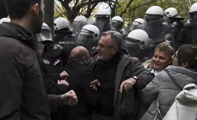 Skirmishes between Serbian police and opposition protesters demanding arrests over a deadly roof collapse at a railway station in Novi Sad, Serbia, Wednesday, Nov. 20, 2024. (AP Photo)