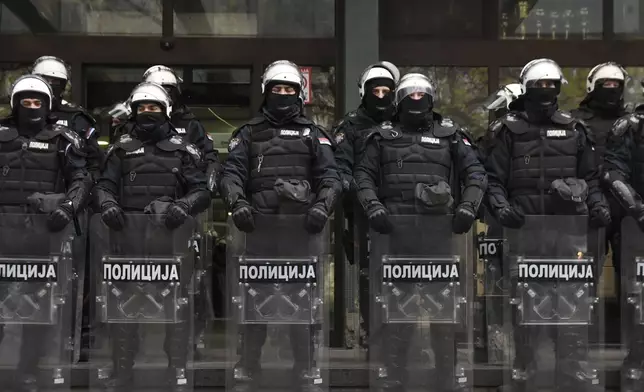 Serbian police officers guard a courthouse during an anti-government protest demanding arrests over a deadly roof collapse at a railway station in Novi Sad, Serbia, Wednesday, Nov. 20, 2024. (AP Photo)