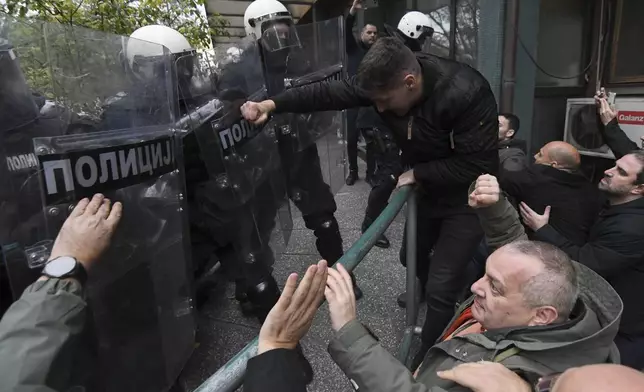 Skirmishes between Serbian police and opposition protesters demanding arrests over a deadly roof collapse at a railway station in Novi Sad, Serbia, Wednesday, Nov. 20, 2024. (AP Photo)