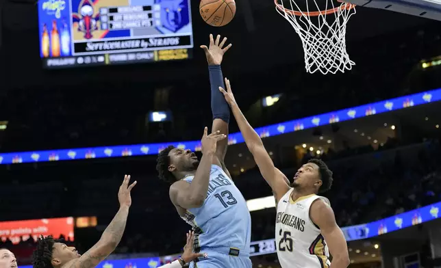 Memphis Grizzlies forward Jaren Jackson Jr. (13) shoots against New Orleans Pelicans guard Trey Murphy III (25) in the second half of an Emirates NBA Cup basketball game Friday, Nov. 29, 2024, in Memphis, Tenn. (AP Photo/Brandon Dill)