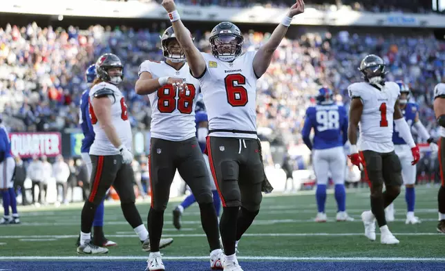 Tampa Bay Buccaneers quarterback Baker Mayfield (6) celebrates his touchdown run against the New York Giants during the first half of an NFL football game Sunday, Nov. 24, 2024, in East Rutherford, N.J. (AP Photo/Rich Schultz)