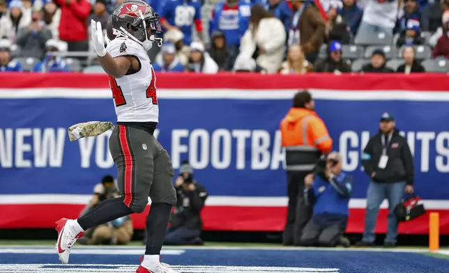 Tampa Bay Buccaneers running back Sean Tucker (44) celebrates his touchdown run against the New York Giants during the first half of an NFL football game Sunday, Nov. 24, 2024, in East Rutherford, N.J. (AP Photo/Rich Schultz)