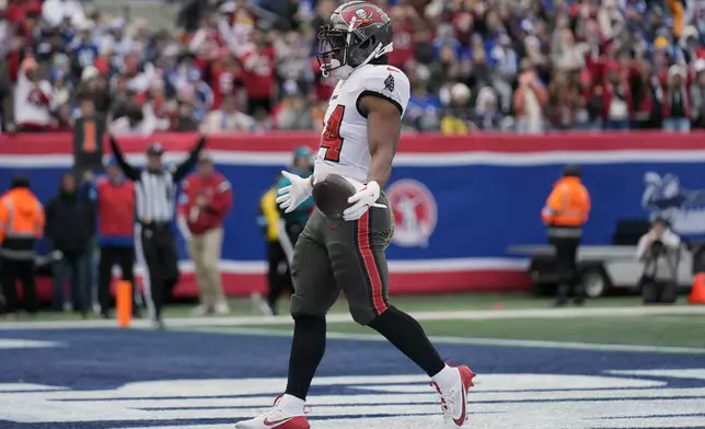 Tampa Bay Buccaneers running back Sean Tucker (44) celebrates his one-yard touchdown run against the New York Giants during the first half of an NFL football game Sunday, Nov. 24, 2024, in East Rutherford, N.J. (AP Photo/Seth Wenig)