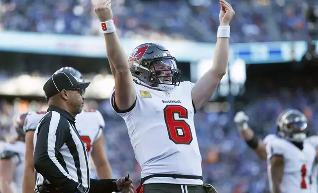 Tampa Bay Buccaneers quarterback Baker Mayfield (6) celebrates his touchdown run against the New York Giants during the first half of an NFL football game Sunday, Nov. 24, 2024, in East Rutherford, N.J. (AP Photo/Rich Schultz)