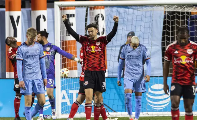 New York Red Bulls ' Noah Eile (3) celebrates after defeating New York City FC 2-0 in an MLS Cup semifinal soccer match, Saturday, Nov. 23, 2024, in New York. (AP Photo/Eduardo Munoz Alvarez)