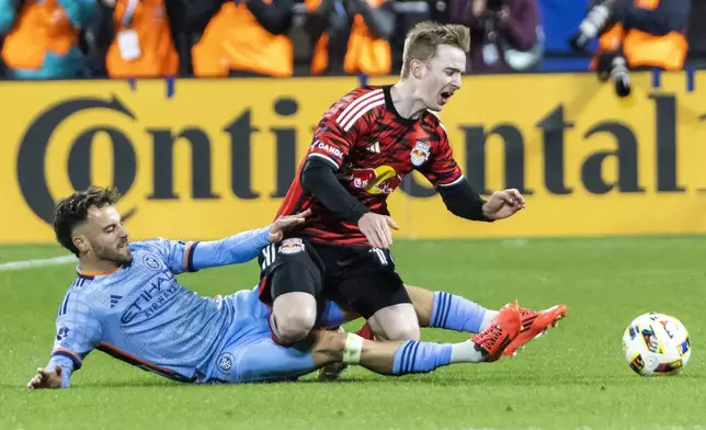 New York Red Bulls defender Cameron Harper, right, is tackled from behind by New York City FC forward Kevin O'Toole during the first half of an MLS Cup semifinal soccer match, Saturday, Nov. 23, 2024, in New York. (AP Photo/Eduardo Munoz Alvarez)