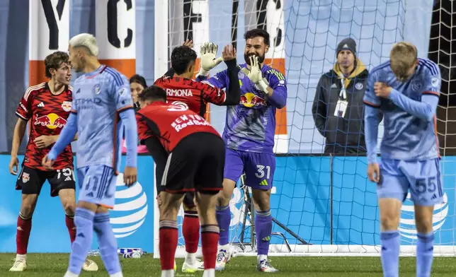 New York Red Bulls players celebrate after defeating New York City FC 2-0 in an MLS Cup semifinal soccer match, Saturday, Nov. 23, 2024, in New York. (AP Photo/Eduardo Munoz Alvarez)