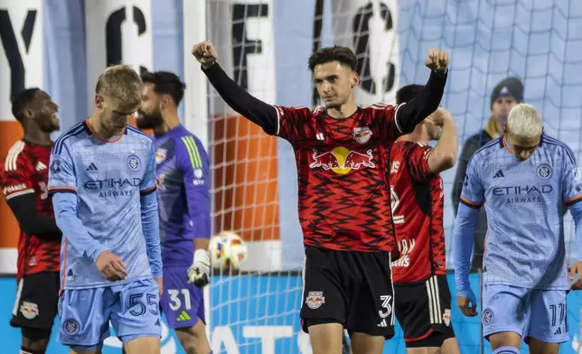 New York Red Bulls ' Noah Eile (3) celebrates after defeating New York City FC 2-0 in an MLS Cup semifinal soccer match, Saturday, Nov. 23, 2024, in New York. (AP Photo/Eduardo Munoz Alvarez)