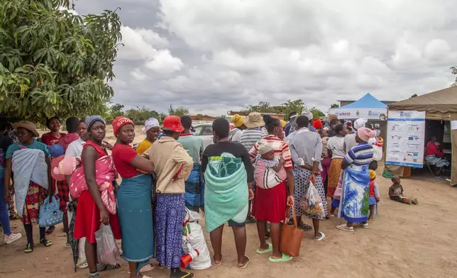 Women attend an outtreach clinic in Epworth, Zimbabwe, Thursday, Nov. 14, 2024. (AP Photo/Aaron Ufumeli)