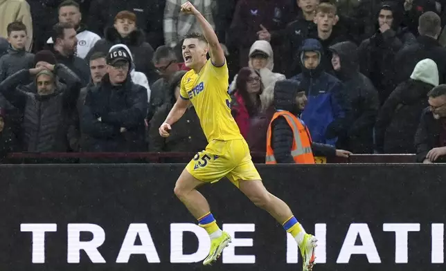 Crystal Palace's Justin Devenny celebrates scoring their side's second goal during the English Premier League soccer match between Aston Villa and Crystal Palace, at Villa Park, Birmingham, England, Saturday Nov. 23, 2024. (Jacob King/PA via AP)