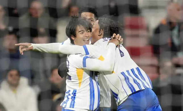 Brighton &amp; Hove Albion's Kaoru Mitoma celebrates scoring their side's second goal during the English Premier League soccer match between Bournemouth and Brighton &amp; Hove Albion, at the Vitality Stadium, Bournemouth, England, Saturday Nov. 23, 2024. (Andrew Matthews/PA via AP)