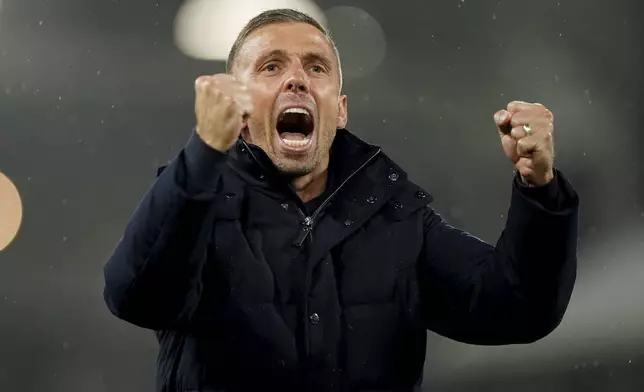 Wolverhampton Wanderers manager Gary O'Neil celebrates after the English Premier League match between Fulham and Wolverhampton Wanderers at Craven Cottage stadium in London, Saturday, Nov. 23, 2024. (Zac Goodwin/PA via AP)