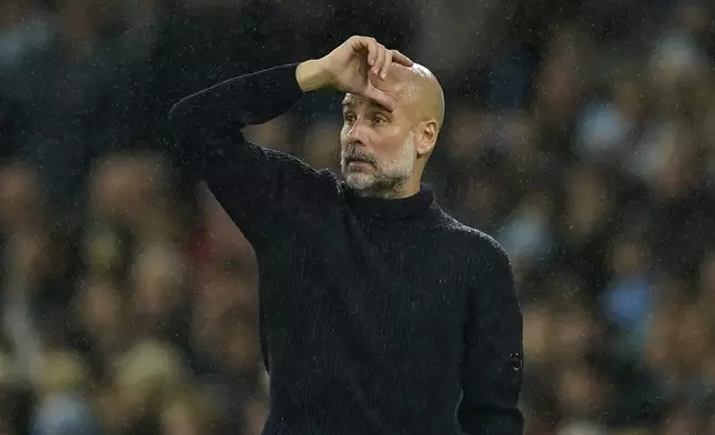 Manchester City's head coach Pep Guardiola gestures during the English Premier League soccer match between Manchester City and Tottenham at the Etihad Stadium in Manchester, England, Sunday, Nov. 24, 2024. (AP Photo/Dave Thompson)