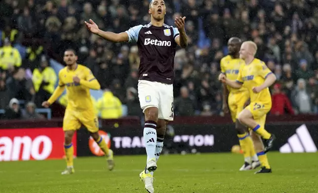 Aston Villa's Youri Tielemans reacts after his penalty is saved by Crystal Palace goalkeeper Dean Henderson during the English Premier League soccer match between Aston Villa and Crystal Palace, at Villa Park, Birmingham, England, Saturday Nov. 23, 2024. (Jacob King/PA via AP)
