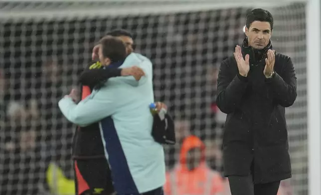 Arsenal's manager Mikel Arteta applauds to supporters at the end of the English Premier League soccer match between Arsenal and Nottingham Forest at Emirates Stadium in London, Saturday, Nov. 23, 2024. (AP Photo/Kin Cheung)