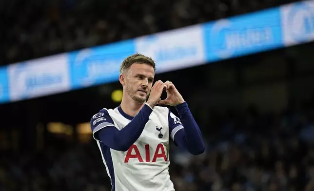 Tottenham's James Maddison celebrates after scoring his side's second goal during the English Premier League soccer match between Manchester City and Tottenham at the Etihad Stadium in Manchester, England, Sunday, Nov. 24, 2024. (AP Photo/Dave Thompson)