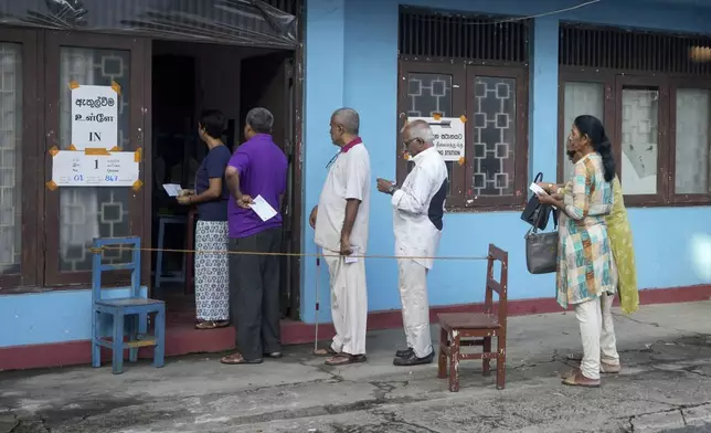 People queue up to cast their votes at a polling station during the parliamentary election in Colombo, Sri Lanka, Thursday, Nov. 14, 2024.(AP Photo/Eranga Jayawardena)