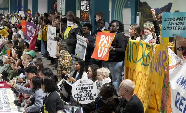 Activists participate in a demonstration at the COP29 U.N. Climate Summit, Saturday, Nov. 16, 2024, in Baku, Azerbaijan. (AP Photo/Rafiq Maqbool)