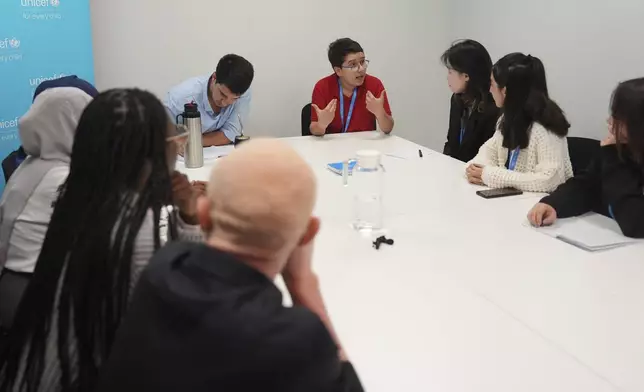 Francisco Vera Manzanares, 15, a climate activist from Colombia, speaks with other youth activists during a forum with young activists, Tuesday, Nov. 12, 2024, at the COP29 U.N. Climate Summit in Baku, Azerbaijan. (AP Photo/Joshua A. Bickel)