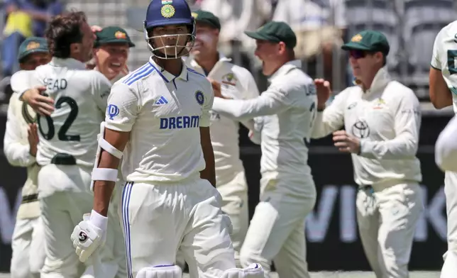 India's Yashasvi Jaiswal leaves the field after losing his wicket to Australia's Mitchell Starc during play in the first cricket test between India and Australia in Perth, Australia, Friday, Nov. 22, 2024. (AP Photo/Trevor Collens)