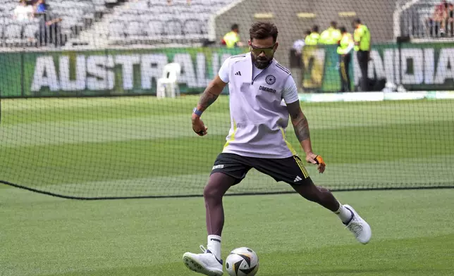 India's Virat Kohli warms up before the start of the first cricket test between India and Australia in Perth, Australia, Friday, Nov. 22, 2024. (AP Photo/Trevor Collens)