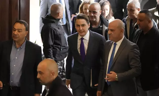 Amos Hochstein, center, a senior adviser to President Joe Biden, is received ahead of a meeting with Lebanese Parliament speaker Nabih Berri, in Beirut, Lebanon, Tuesday, Nov. 19, 2024. (AP Photo/Hassan Ammar)