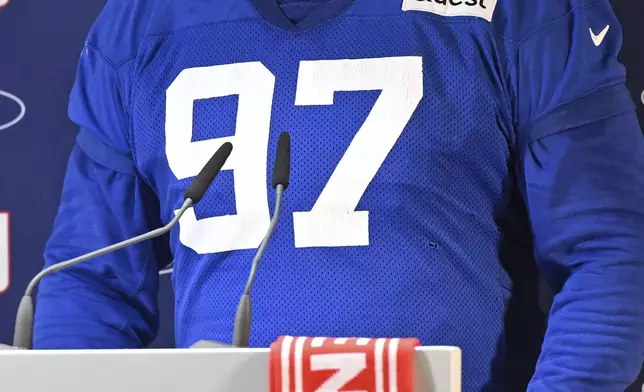 New York Giants defensive tackle Dexter Lawrence II (97) attends a news conference after a practice session in Munich, Germany, Friday, Nov. 8, 2024. The New York Giants are set to play the Carolina Panthers in an NFL game at the Allianz Arena in Munich on Sunday. (AP Photo/Lennart Preiss)