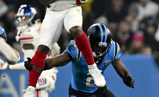 New York Giants wide receiver Malik Nabers catches a pass against the Carolina Panthers during the second half of an NFL football game, Sunday, Nov. 10, 2024, in Munich, Germany. (AP Photo/Lennart Preiss)