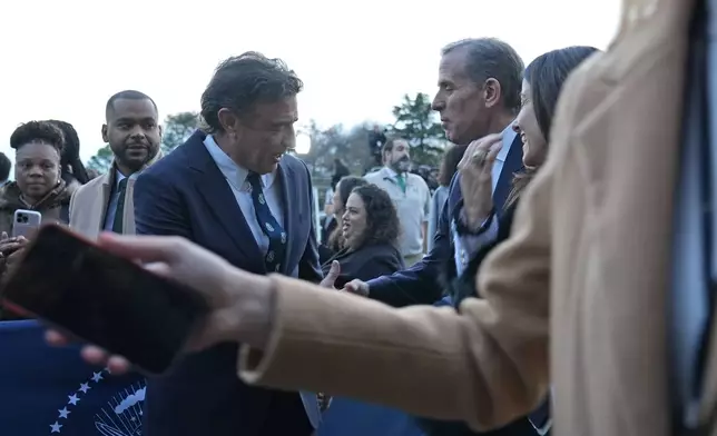 Hunter Biden, second from right, talks with Boston Celtics owner Wyc Grousbeck, left, following an welcoming the Boston Celtics to celebrate their victory in the 2024 National Basketball Association Championship, on the South Lawn of the White House in Washington, Thursday, Nov. 21, 2024. (AP Photo/Susan Walsh)